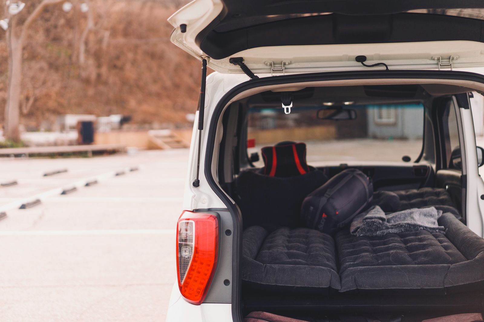 A sleeping environment in the back of a vehicle.