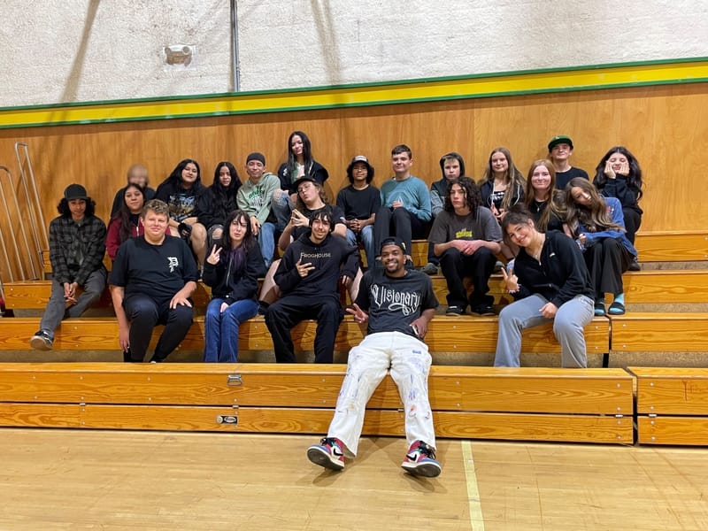 Brandon Leake with students at Downieville School.
