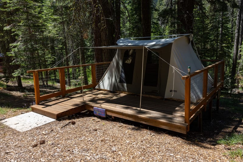 Student-reservable tents are set up on wooden platforms