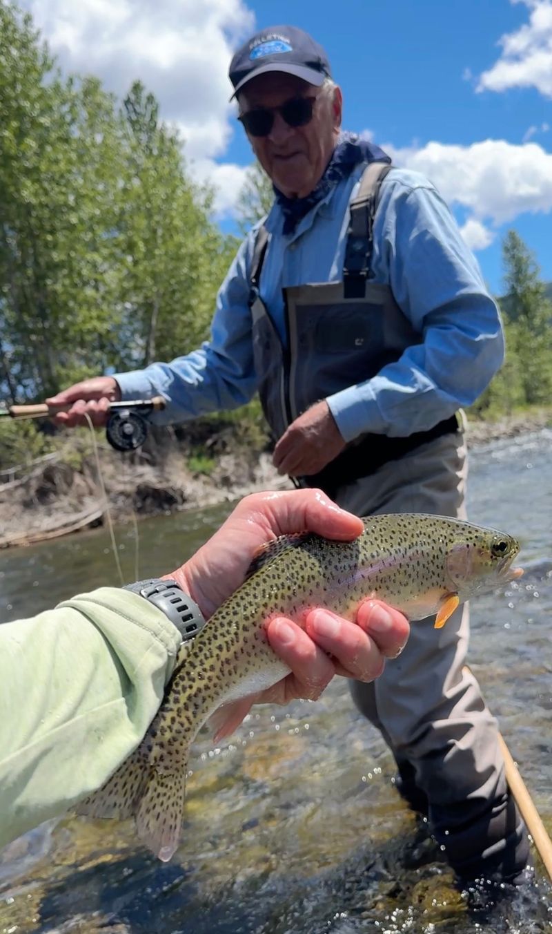 Lenny with a trout caught in the Finn River.