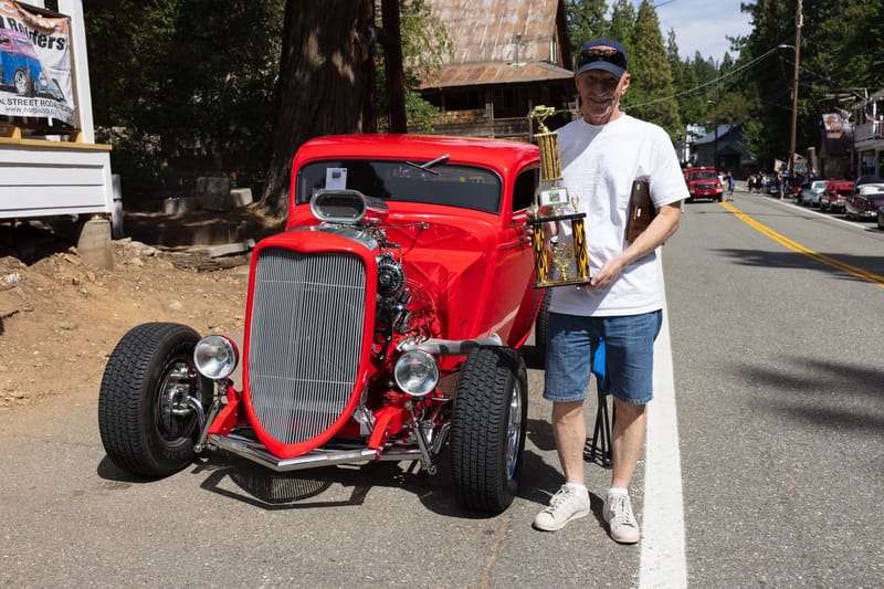 Charlie Catron next to his show-winning car
