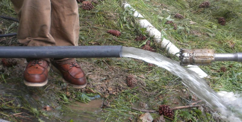 Ray Wittkopp’s feet next to the second successful and fastest flowing driven pipe. May 15, 2017.