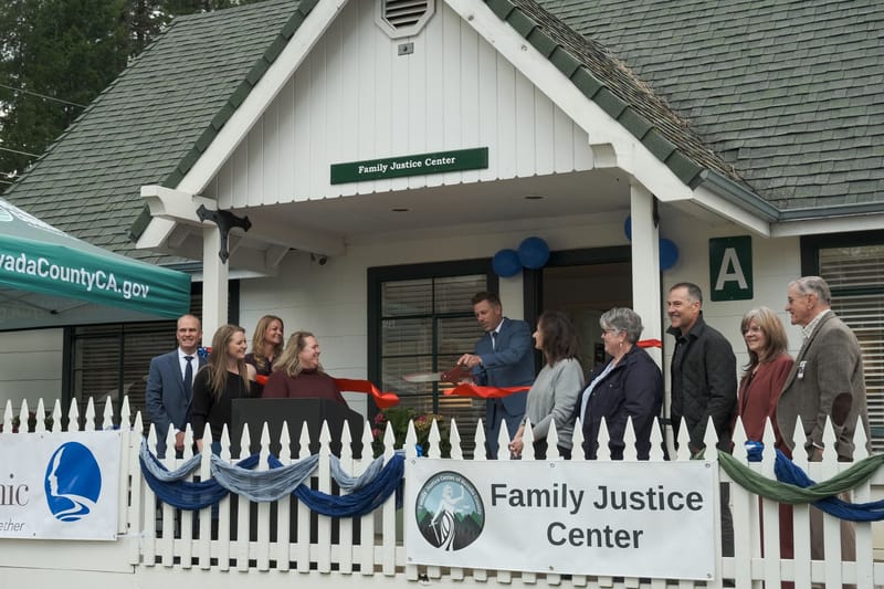 District Attorney Jesse Wilson cuts the ribbon in front of the Family Justice Center beside community leaders and partners. Credit: Nevada County District Attorney’s Office / Facebook.