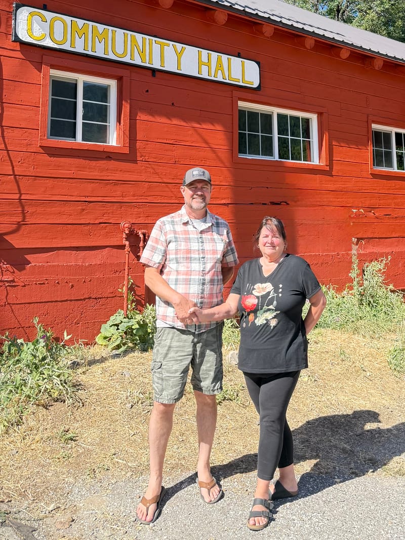 Jim Westfall and Tamara Rangel in front of the Sierra City Community Hall.