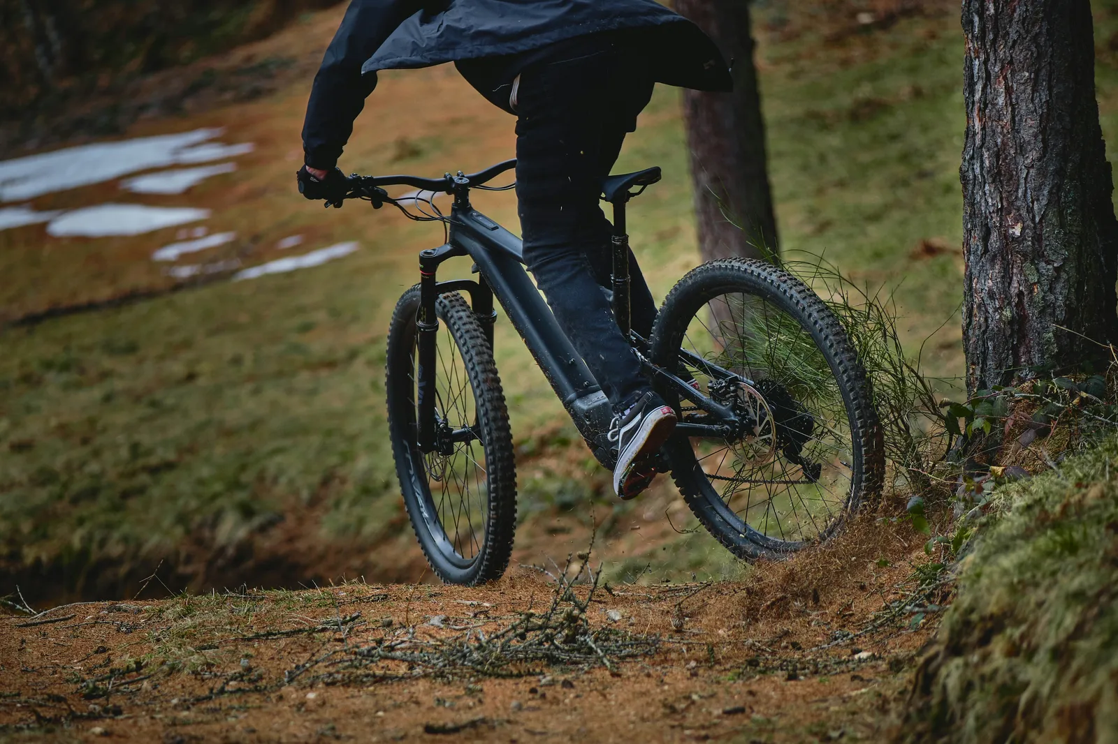 An electric mountain bike being ridden.