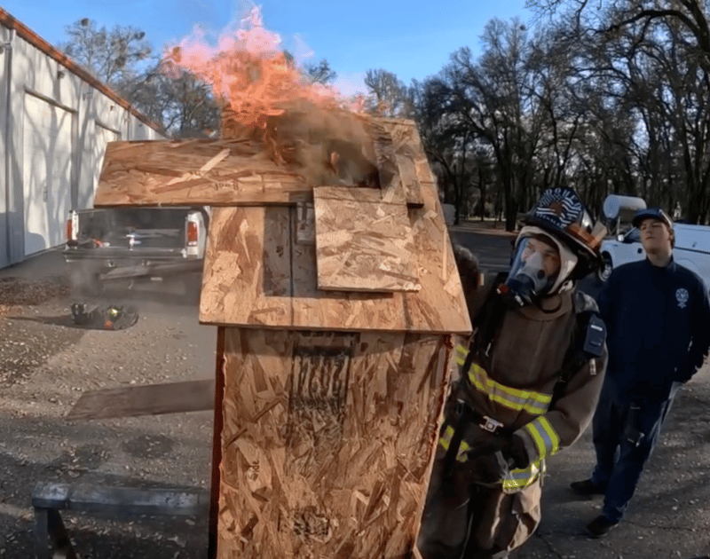 A plume at the top of the model is lit to demonstrate smoke acting as fuel