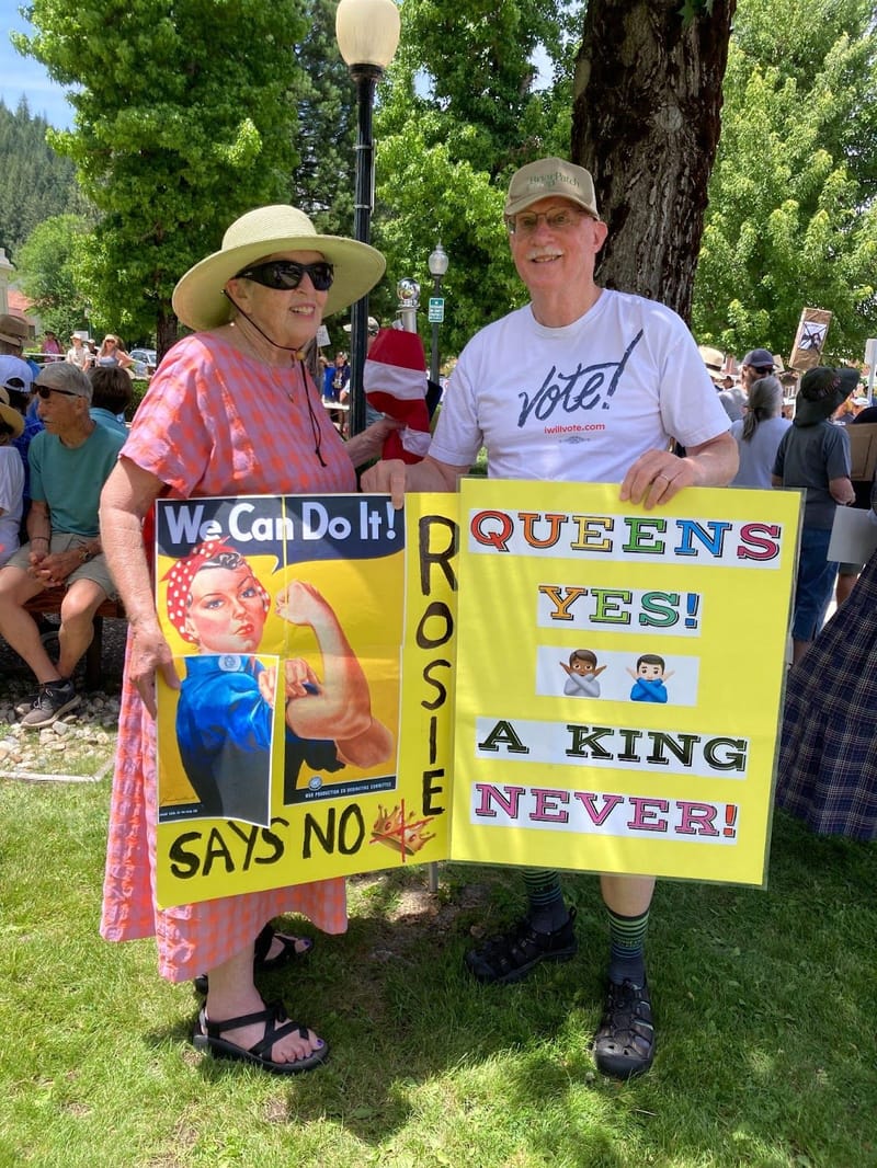 Linda and Paul Guffin, of Downieville, with their protest signs.