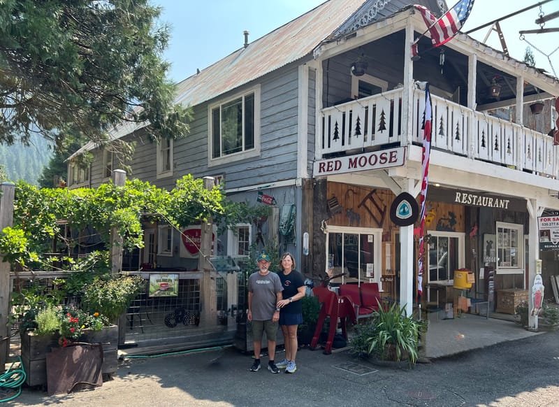 Steve and Jenny Traverso in front of the Red Moose Cafe in Sierra City.