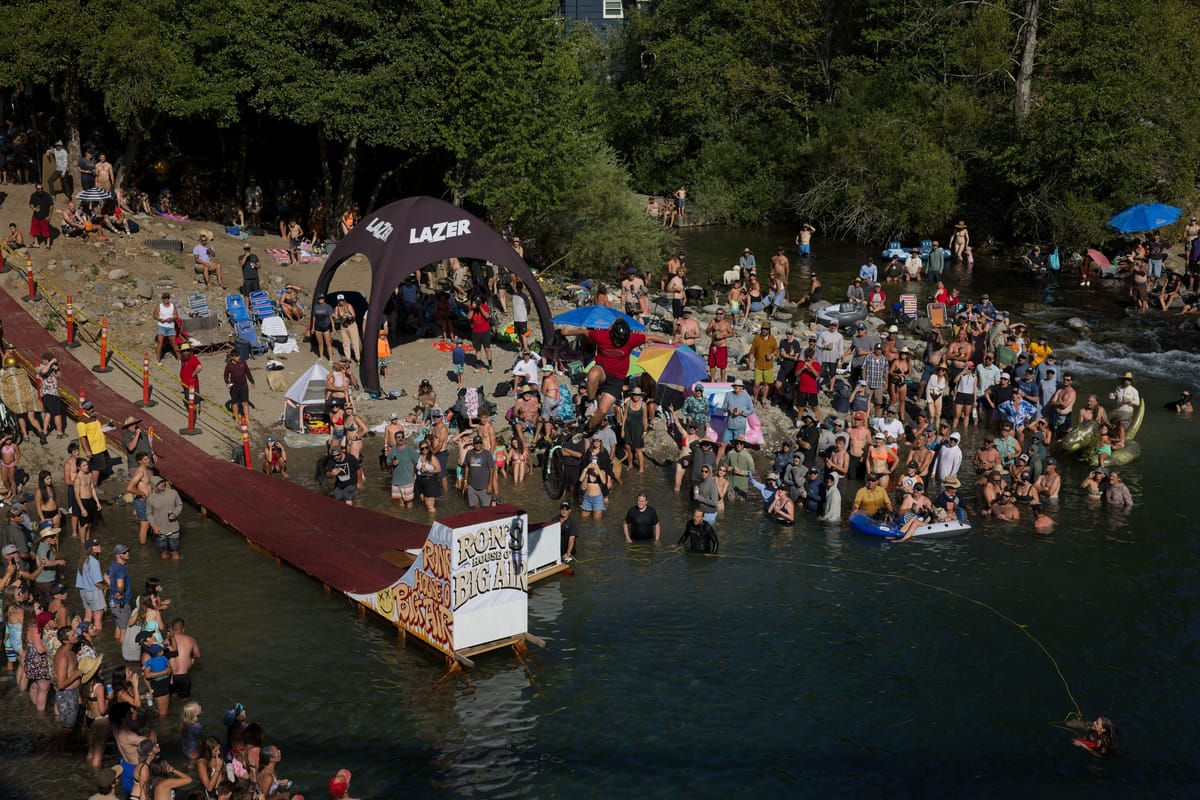 A Ron’s House o’ Big Air participant jumps into the Yuba River Confluence.