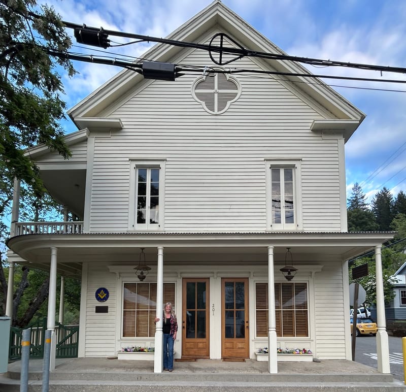 Local resident Mrs. Kristy Folsom on the porch of the previous Masonic Mountain Shade Lodge #18, now an office building.