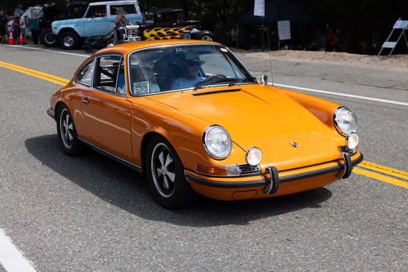 Steve and Karen Thomas’s 1970 Porsche, “Taking Care of Business” winner, in the parade