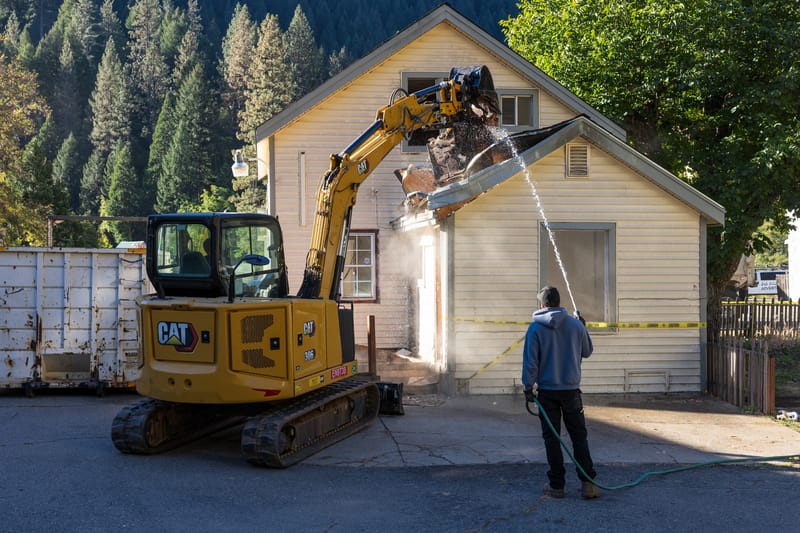 Demolition begins at the Main Street property.