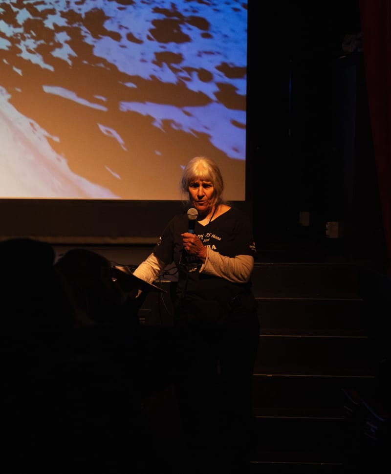 Caroline “Cracker” Eshleman, President of the Sierra County Arts Council, speaks before Friday’s screening.