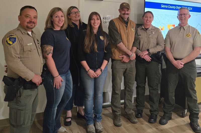 (Left to Right) Captain Chris Stoots, Scientist Megan O’Connor, Regional Manager Morgan Kilgour, Scientific Aid Arianna Sarchi Flood, Wildlife Lands Supervisor Ryan Leahy, Assistant Chief Erica Manes, and Sheriff Mike Fisher at the town hall meeting in the Downieville Community Center
