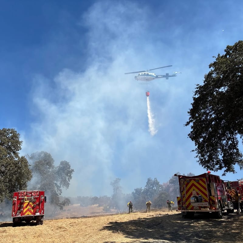 A helicopter and ground crews fight the Perimeter Fire. Photo: Nevada County Sheriff’s Office.